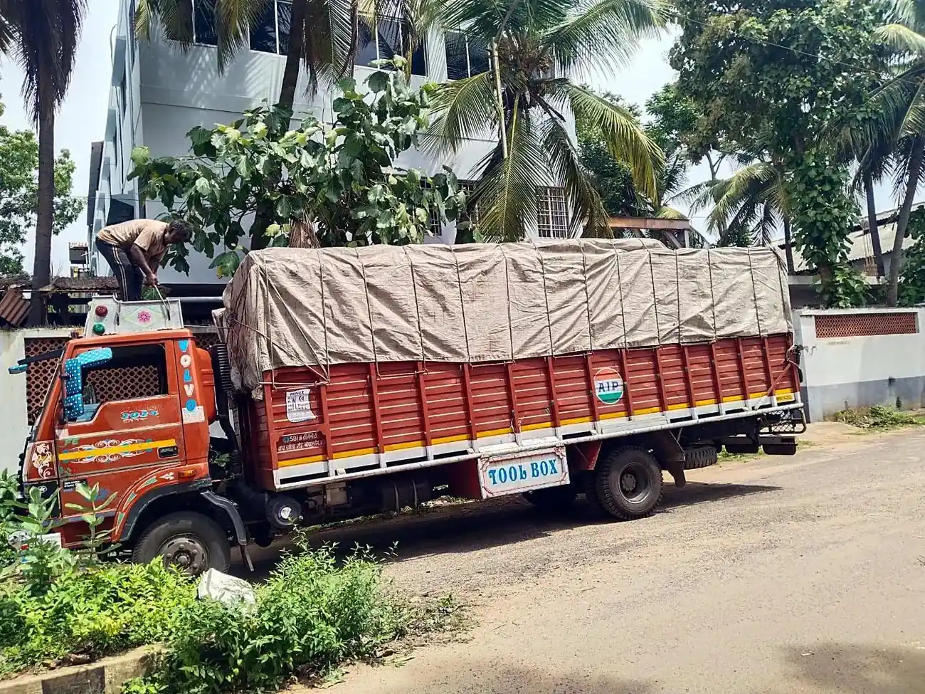 Truck with a tarpaulin-covered full load
