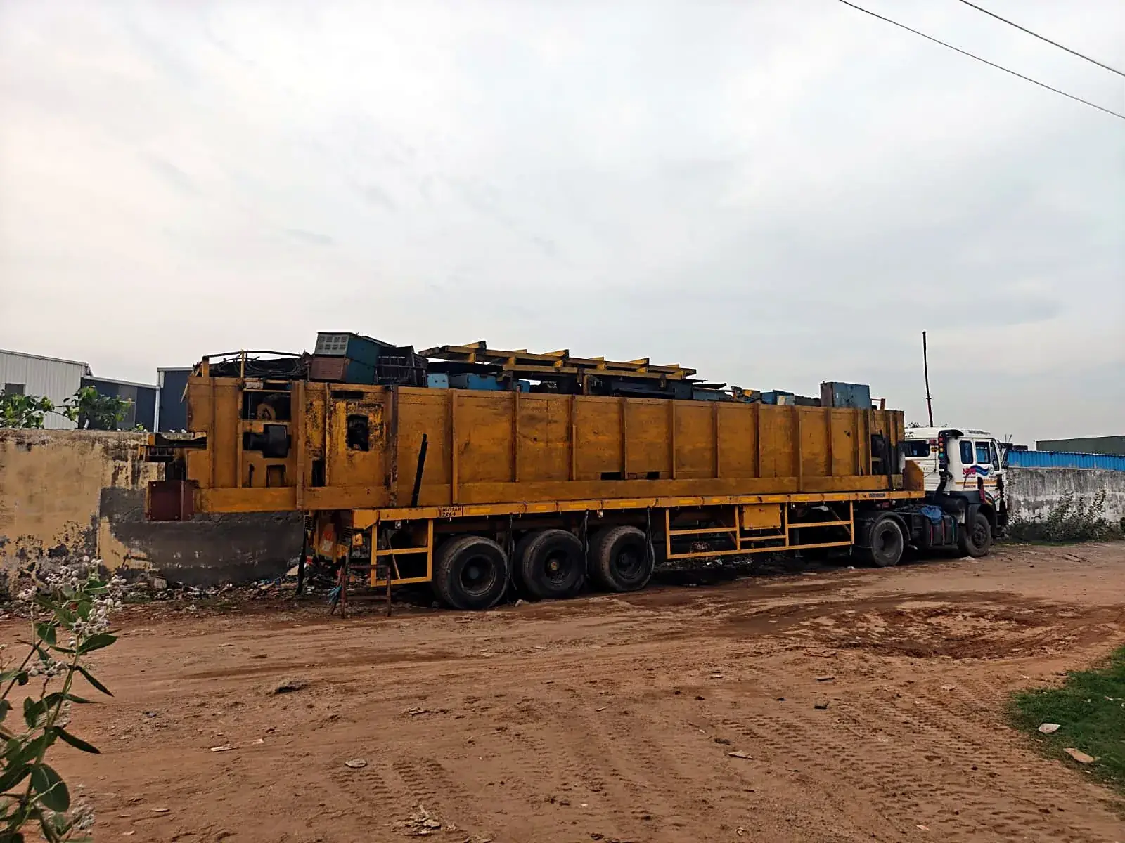 Heavy plant machinery load on a long trailer