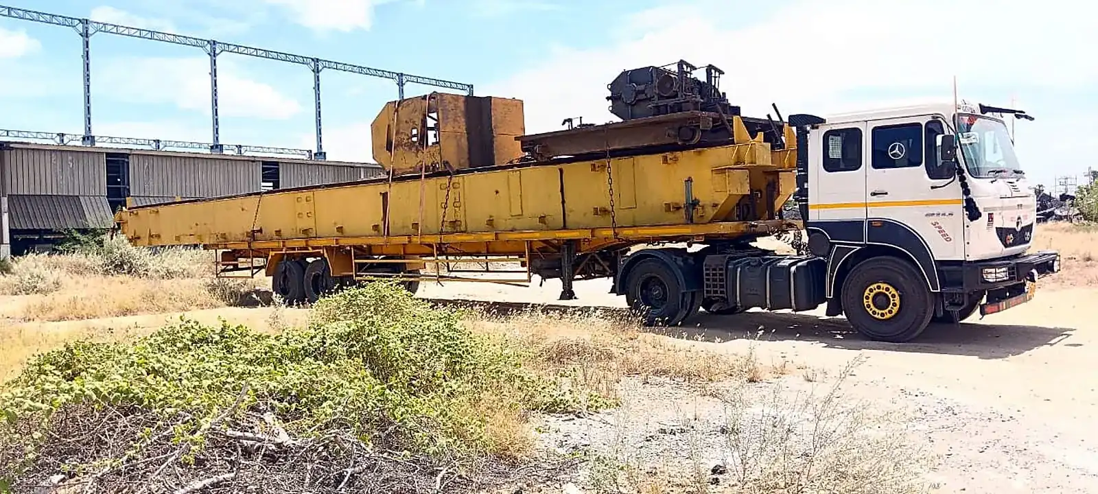 All India transport network: long girder hauled by a GRC tractor unit